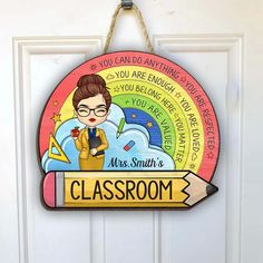 a classroom sign hanging on the front door