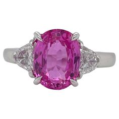 Ring contains one center GIA certified oval shape pink sapphire weighing 4.17ct. Center stone is accented by two side half moon cut diamonds weighing a total of 0.52cts. Pink Sapphire and diamonds are mounted in a handmade basket prong setting. Diamonds are F in color and VS2 in clarity. Pink sapphire measures 10.17x7.74mm and originates from Madagascar. Ring is a size 6.25 and can be resized to desired measurement. Please request customization. All of our pieces are packaged carefully and accom Moon Cut, Diamond Three Stone Ring, Gold For Sale, Three Stone Ring, Handmade Baskets, Three Stone Rings, Dream Jewelry, Sapphire Diamond, Three Stone