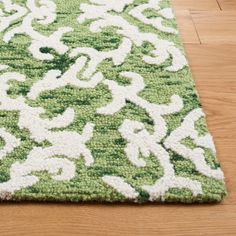 a green and white rug on the floor