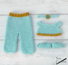 a crocheted baby outfit and booties are shown