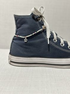 This shoe chain makes a great accessory for your outfit! You can even switch them out easily or use it as an anklet if desired! Item varies in length - around 8.5-9 inches in total. Seed Bead Shoe Chain, Beads For Shoes, Beaded Shoelaces, Shoe Charms Diy, Shoe Chains, Shoe Bracelet, Shoe Accessories Diy, Shoe Chain, Shoe Pendant