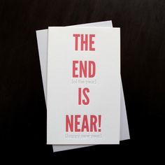 the end is near greeting card with red lettering on white cardstocked in black paper