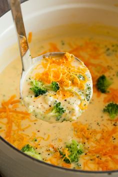 a ladle full of broccoli and cheese soup