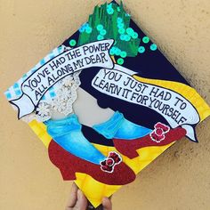 someone is holding up a graduation cap that says you have the power to look at my dear