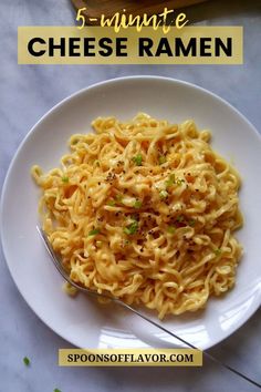 a white plate topped with noodles next to a bowl of broccoli and cheese