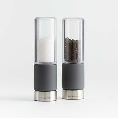 two salt and pepper shakers sitting on top of each other