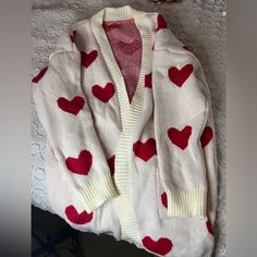 Never Worn White Heart Sweater For Winter, White Heart-shaped Sweater For Spring, Casual Heart Print Cardigan For Spring, Cute White V-neck Outerwear, White Heart Print Sweater For Winter, Cute White Winter Cardigan, Cute White Cotton Cardigan, White Sweater For Valentine's Day, Cute White Long Sleeve Cardigan