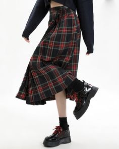 This black and red plaid midi skirt comes with a high-waist design and bold, layered pleats. Ideal for a preppy aesthetic, it adds an modern twist to any wardrobe. Size:• S: Waist: 66cm/ 26.0 in, Length: 78cm/ 30.7 in• M: Waist: 70cm/ 27.6 in, Length: 79.5cm/ 31.3 in• L: Waist: 74cm/ 29.1 in, Length: 81cm/ 31.9 inMaterial: Polyester Long Plaid Skirt Outfit, Preppy Girl Style, E Girl Clothes, Preppy Aesthetic Outfits, Long Plaid Skirt, Outfit Dark, Argyle Vest, Dark Academia Outfits, Plaid Skirt Outfit