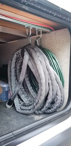 there are many hoses in the back of a car