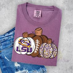 Get ready for gameday with our LSU Fall Pumpkins t-shirt! Made on a comfy unisex Comfort Colors brand shirt, this shirt is available in two beautiful fall colors. Show off your team spirit and love for the season in style! Collegiate Fall Fan Merchandise T-shirt, Collegiate Fan Merchandise T-shirt For Fall, Team-colored T-shirt For Game Day In Fall, Team Spirit Game Day T-shirt For Fall, Team Spirit T-shirt For Game Day In Fall, Fall Fan Merchandise T-shirt With Team Name, Fall School Spirit T-shirt For Sports Events, School Spirit T-shirt For Fall Season, Sports Fan T-shirt For Game Day In Fall