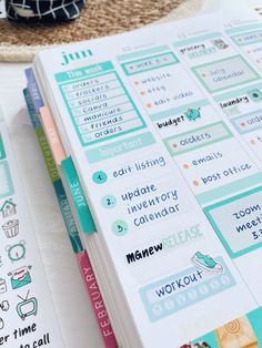 an open planner book sitting on top of a table