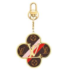 a louis vuitton key chain with an emblem on it