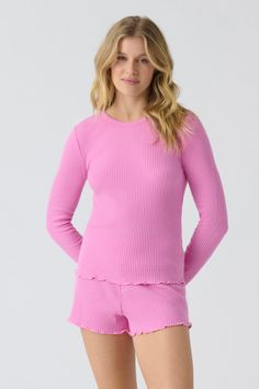 Pink fitted long sleeve rib top in Repreve x Reloved recycled soft knit with merrow stitched hem. Spring Soft Knit Loungewear Tops, Trendy Ribbed Pink Tops, Trendy Pink Ribbed Tops, Ribbed Long Sleeve Top For Loungewear, Long Sleeve Ribbed Top For Loungewear, Ribbed Stretch Long Sleeve Top For Loungewear, Cozy Pink Ribbed Sweater, Trendy Pink Long Sleeve Top For Spring, Casual Pink Stretch Long Sleeve Top