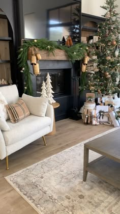 a living room filled with furniture and a christmas tree