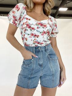 Florals? For Spring? Groundbreaking. However it's easy to say yes to florals when they're this cute! This darling top has the following details: ruched front, v-neckline, puff sleeves with smocked cuffs, smocked backing, and a ruffle hem. Tuck this top into a pair of shorts for a complete look. SIZING - Runs true to size. - Morgan F. is 5'4" and is shown wearing a size small. MATERIAL + CARE - Self: 100% Rayon - Lining: 100% Polyester - Hand wash cold water, do not bleach, line dry, iron low, do Impressive Outfits, Trendy Boutique Clothing, Lane 201, Junior Fashion, Trendy Boutique, Denim Shorts Women, Say Yes, Women Clothing Boutique, Clothing Boutique