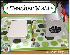 a teacher's desk with a green and white polka dot tray holding a notepad