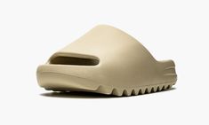 The adidas Yeezy Slide “Pure” is one of three earth tone colorways of the comfortable slip-on sandal to be released by Kanye West and adidas in April 2021.  Releasing next to the “Core” and “Resin” styles, the “Pure” features a beige-colored lightweight EVA foam construction for maximum comfort whether walking through the city streets or relaxing poolside.  Like all Yeezy Slides, the midfoot arch stabilizes the foot and the ridged outsole ensures grip on slippery surfaces.  Release date: April 2 Adidas Yeezy Slide, Adidas Slides, Yeezy Slides, Stadium Goods, Eva Foam, The Pure, Trendy Shoes, City Streets, Adidas Yeezy