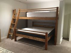 there is a bunk bed with a ladder next to it in the room that has carpet on the floor