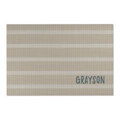 gray and white striped placemat with the word grason in blue on it