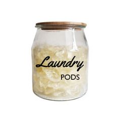 a glass jar with laundry pods in it