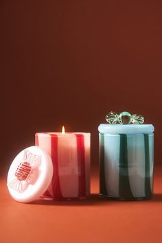 two candles sitting next to each other on a table