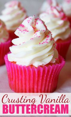 cupcakes with white frosting and pink sprinkles