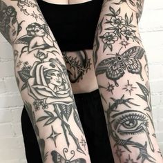 a woman with many tattoos on her arms