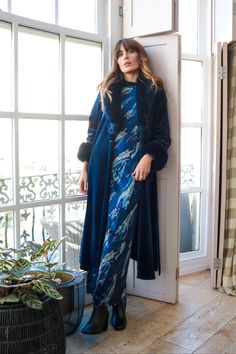 Our Yasmine dress is a stunning blue and metallic print maxi dress, with long fitted sleeves and a beautiful silhouette. It's completed with a flattering side split. It's the perfect dress to dress up with heels for those upcoming festive parties. Or keep it casual with a pair of boots, perfect for the winter season. The perfect versatile dress! 60% Viscose 35% Polyester 5% Elastane Machine wash 30c. Do not bleach. Do not tumble dry. Coo iron only. Elegant Blue Winter Maxi Dress, Elegant Blue Maxi Dress For Winter, Blue Formal Maxi Dress For Winter, Long Blue Evening Dress, Long Sleeve Maxi Dress With Side Slits For Evening, Blue Long Dress With Side Slits, Blue Long Maxi Dress For Formal Occasions, Blue Long Dresses With Side Slits, Blue Long Evening Dress