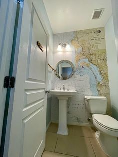 a bathroom with a map on the wall