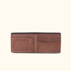 Inspired by the wild and untamed wilderness, where the spirit of adventure thrives, lies the Roosevelt Billfold Wallet. A classic billfold wallet crafted with the rugged elegance of water buffalo leather in full-grain texture bears the marks of a life lived in pursuit of the extraordinary. The richness of its water buffalo leather and suede interior is a testament to nature's enduring beauty. You'll find a prominent display for your photo ID, a window into your narrative. Four sturdy slots on th Brown Wallet With Leather Lining For Everyday Carry, Brown Leather Lined Wallet For Everyday Carry, Brown Leather Wallet For Everyday Carry, Bifold Waxed Finish Wallets For Everyday Carry, Leather Trifold Wallet With Waxed Finish, Rugged Bifold Wallet For Everyday Use, Rustic Bifold Wallets For Everyday Use, Brown Leather Trifold Wallet With Waxed Finish, Brown Waxed Finish Wallets For Everyday Carry