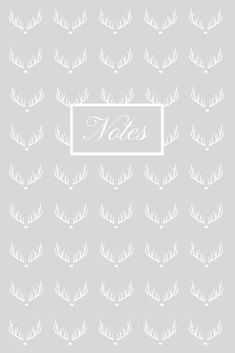 white deer antlers on a gray background with the word noe written in it