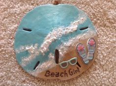 a beach themed ornament with flip flops and sandals