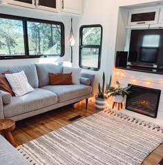 a living room filled with furniture and a fire place