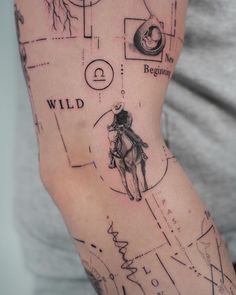 a man with a tattoo on his arm has a map and a cowboy riding a horse