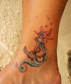 a foot with an anchor tattoo on it