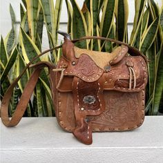 Tooled Leather Horse Western Saddle Bag Purse X Body Cowgirl Brown Tan Metal Accents Mexico Vtg 70s Vintage 1970s. Measurements Are Approximate: Width - 9” Height - 7.5” (Not Including Metal Saddle Horn) Depth - 3” Scuffs And Wear. No Fading, Rips, Tears, Or Holes. See Pictures For Additional Details Of Condition. Smoke Free Home. Hand Tooled Brown Leather Saddle Bag, Vintage Brown Rectangular Hand Tooled Shoulder Bag, Retro Brown Hand Tooled Shoulder Bag, Retro Vintage Brown Hand Tooled Shoulder Bag, Western Purses With Fringe, Brown Retro Shoulder Bag With Hand Tooled Details, Saddle Bag Purse, Western Purses, Western Saddle