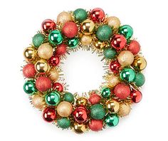 a christmas wreath with ornaments hanging from it's sides on a white background photo