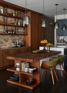 a kitchen with an island and wooden shelves