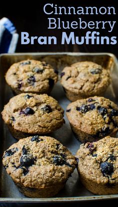 blueberry bran muffins on a baking sheet with the title in the middle