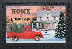 a red truck is parked in front of a house with a christmas tree and snowman