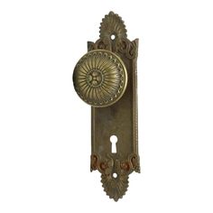 an antique brass door handle with a decorative design