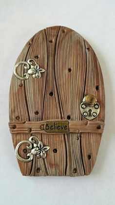 a wooden box with metal decorations on it