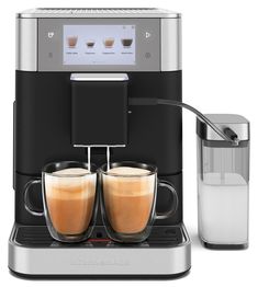 a coffee machine with two cups on the front and one cup filled with liquid next to it