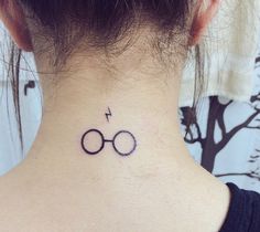 a harry potter symbol tattoo on the neck