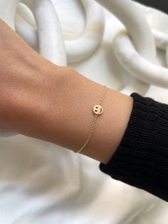 Beautifully handcrafted 14k gold tiny smile emoji bracelet available in yellow, white, and rose gold. Perfect solo or stacked, a fun and timeless everyday bracelet. Made in L.A. Size of Smile Emoji: Approx. 5mm Total Weight: Approx. 1 gram Ships in 4-8 business days Rush orders ship in 2-5 business days Comes gift ready in a custom Zoe Lev jewelry box Smile Emoji, Everyday Bracelet, Letter Ring, Initial Pendant Necklace, Initial Ring, Hand Chain, Evil Eye Bracelet, Initial Pendant, Letter Necklace