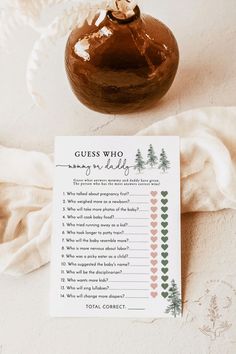 a brown vase sitting on top of a table next to a paper with a question