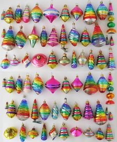 there are many colorful ornaments hanging on the wall