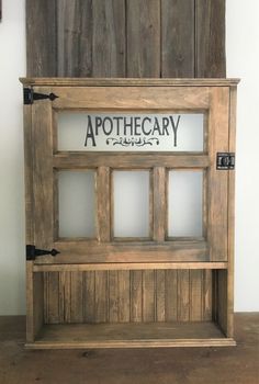 a wooden shelf with some writing on it