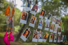 several pictures hanging from clothes pins on a line