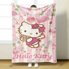 a hello kitty towel hanging on the wall